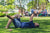 A man is enjoying Father’s Day activities with his daughter while at a park