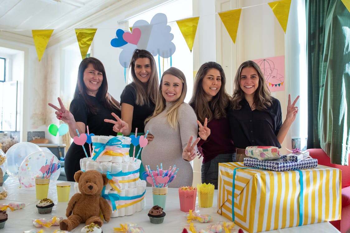 Five women celebrating a gender-neutral baby shower