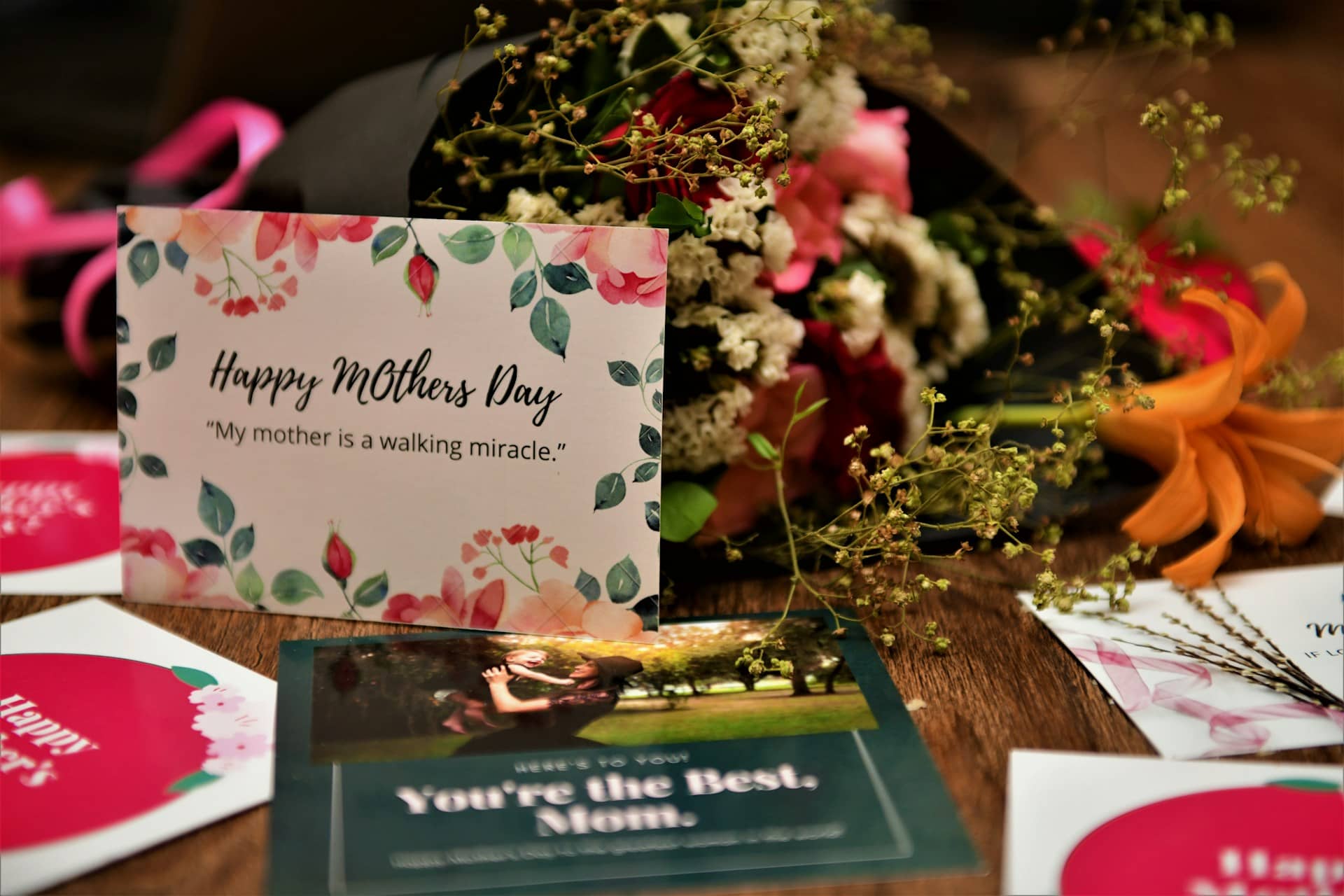 A table set with Mother’s Day cards and flowers