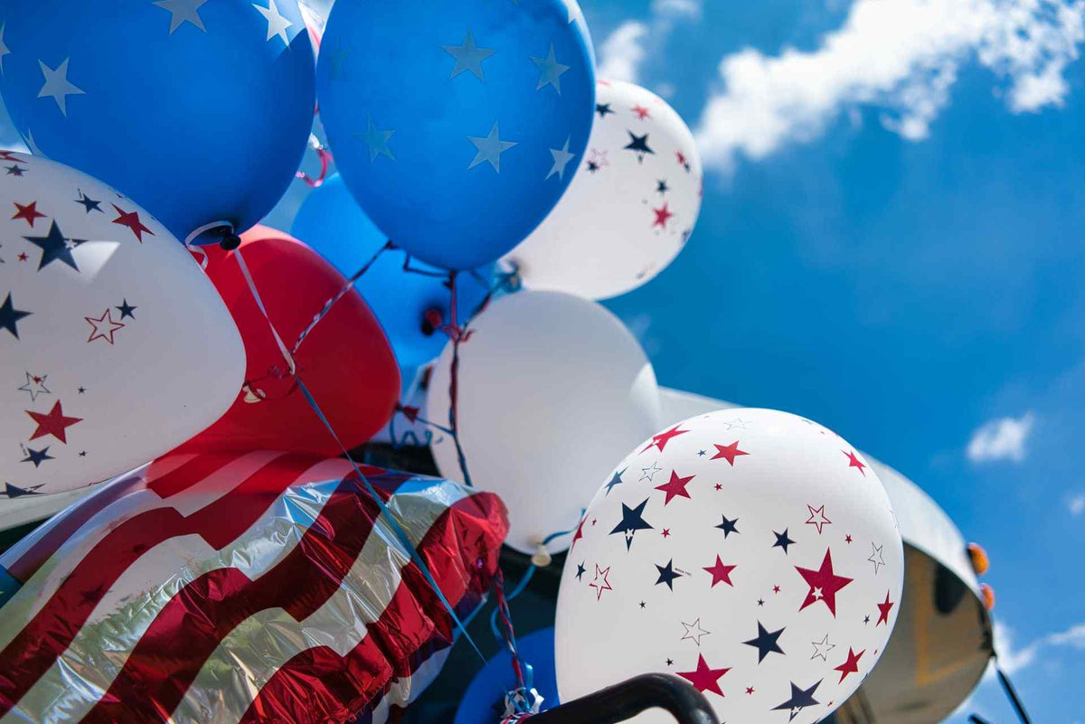 red, white, and blue party balloons