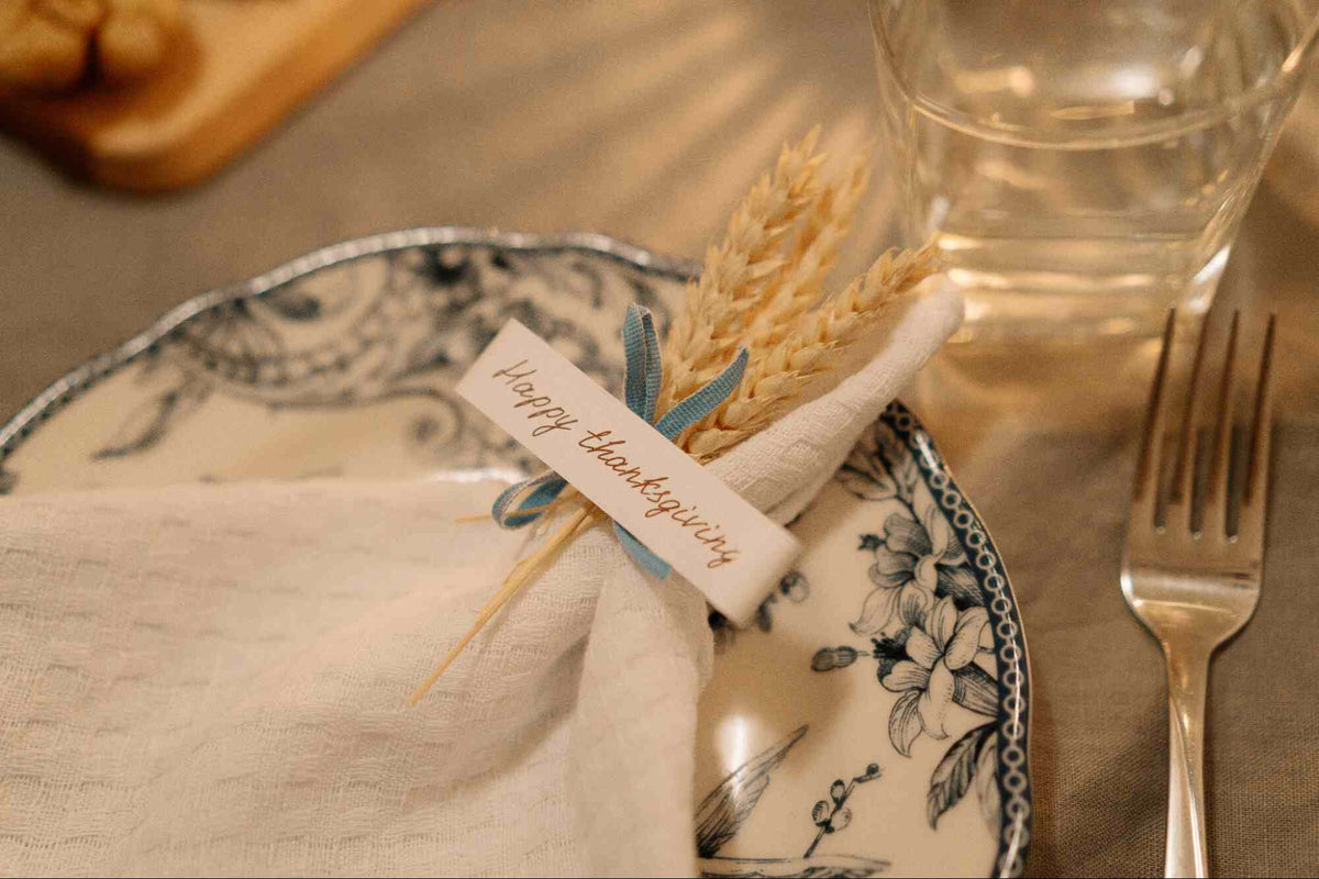 A close-up of a table set for Thanksgiving dinner