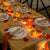 pumpkins and leaves in a fall table setting