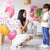 boy giving mom balloons for mothers day