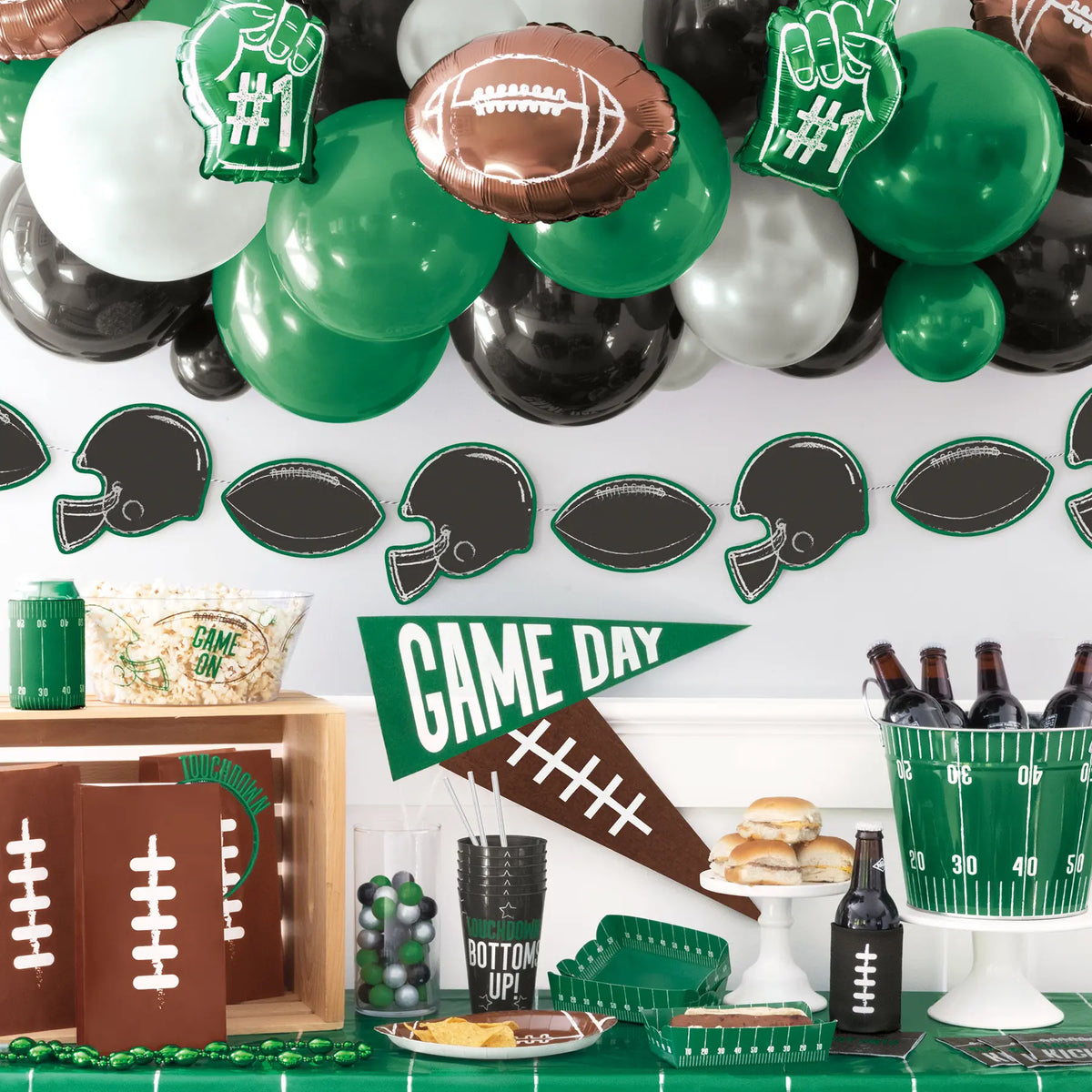football gameday green and white balloons and party decorations